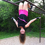 Upside down on monkey bars