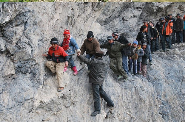 80 school children make embark on a treacherous 125-mile journey through the frigid Xinjian Ulghur mountains to get home