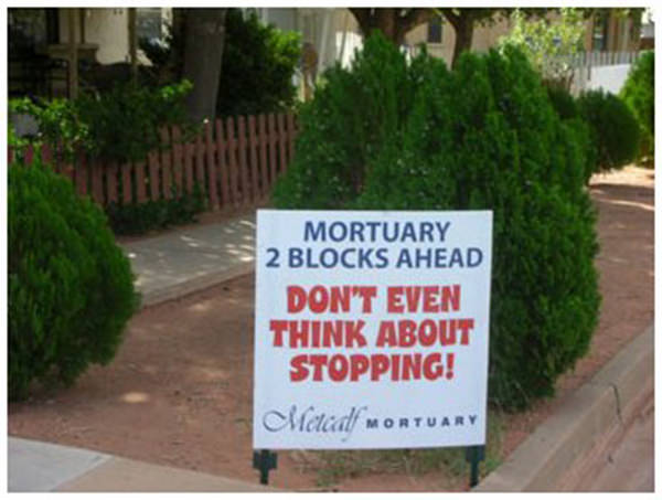 Funniest Running Signs #i: Mortuary Ahead. Don't even think about stopping.