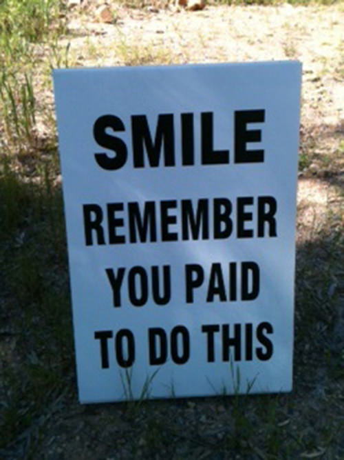 Funniest Running Signs #i: SMILE. Remember you paid to do this.