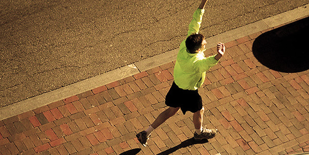 Runner With Arms Raised