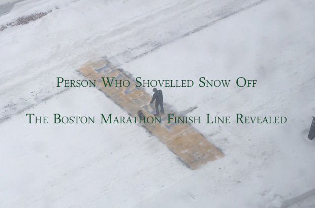 Man Shovelling Snow Off Finish Line of the Boston Marathon
