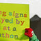 Running Signs Displayed By Kids At A Marathon