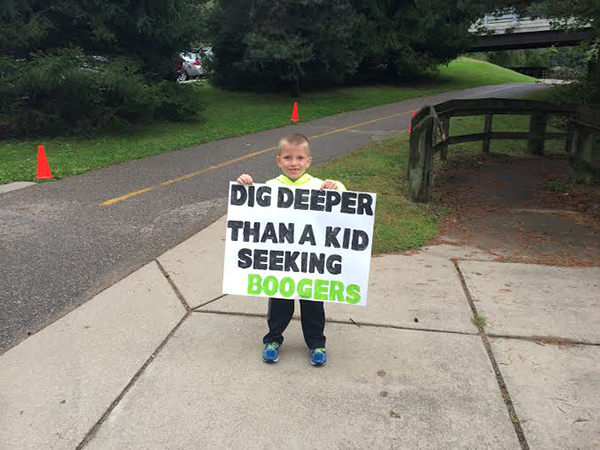Kid Running Signs At A Race #17: Dig deeper than a kid seeking boogers.