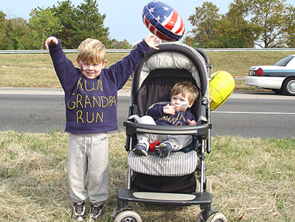 Kid Running Signs At A Race #8: Run, grandpa, run.